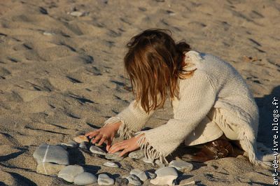 comme l'enfant sur la plage